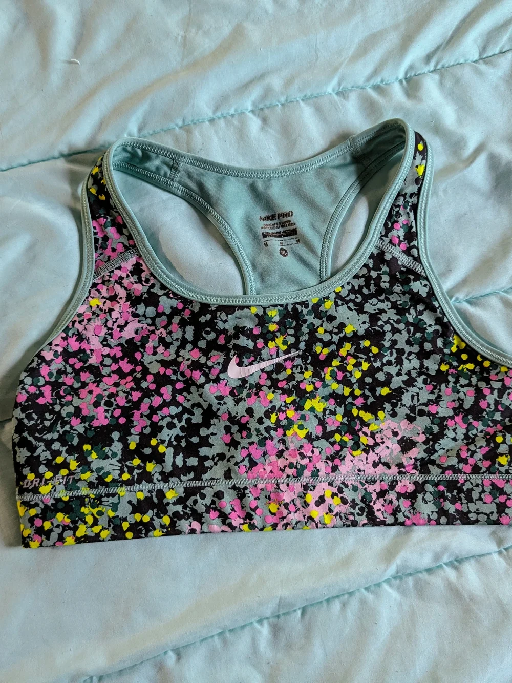 Nike Speckle Print Racerback Sports Bra in Black, Pink & Yellow